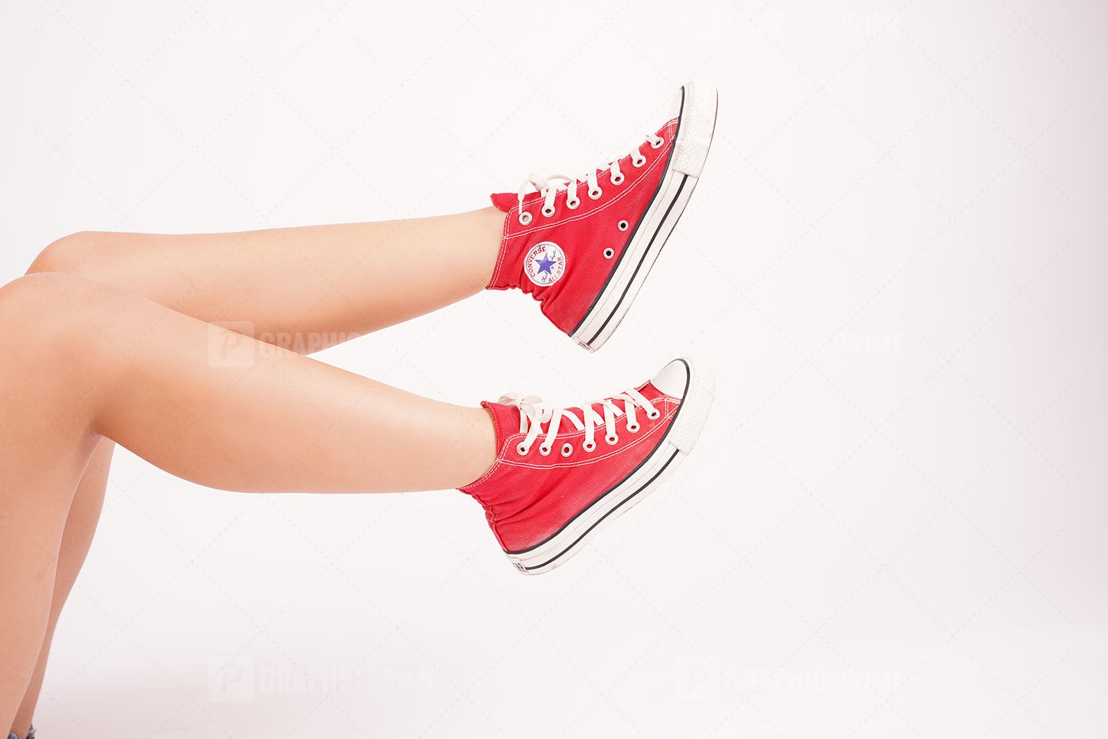 Female in red sneakers stock photo 